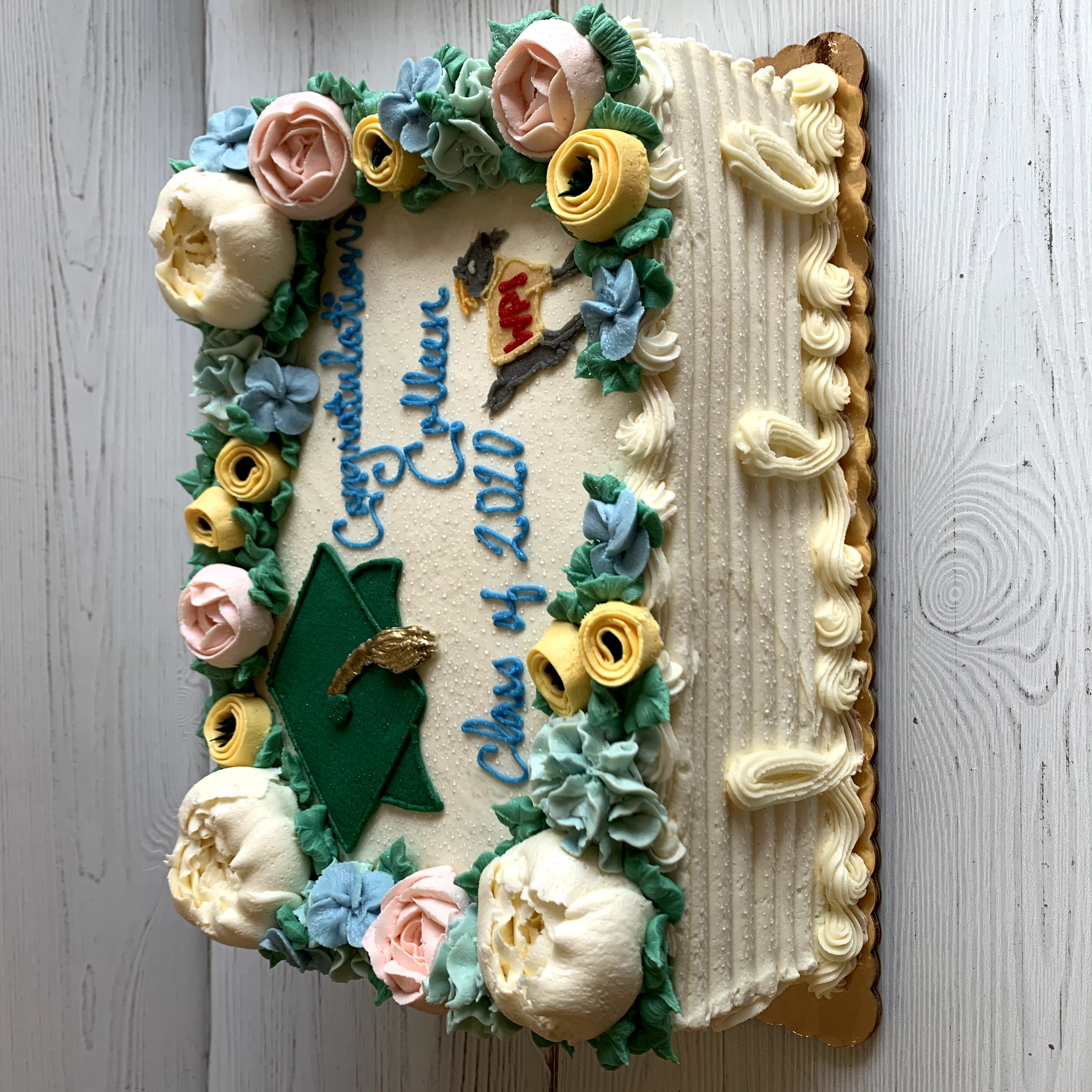 Floral Graduation Cake with Grad Cap and Logo