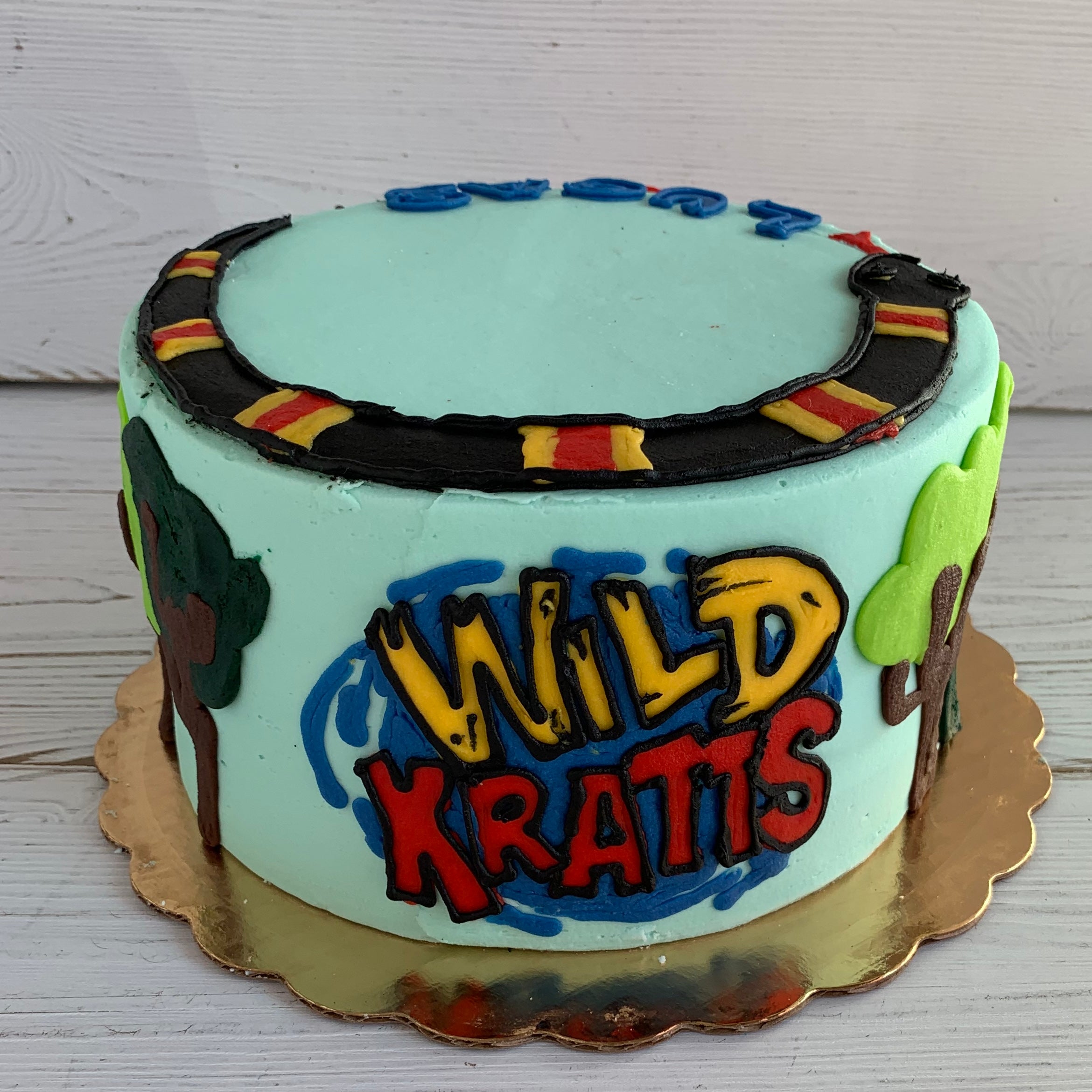 Amazon.com: Treasures Gifted Officially Licensed Wild Kratts Birthday Party  Supplies - Cake Topper Set - 1 Wild Kratts Cake Topper & 24 Wild Kratts  Cupcake Toppers & Wrappers - Wild Kratts Cake